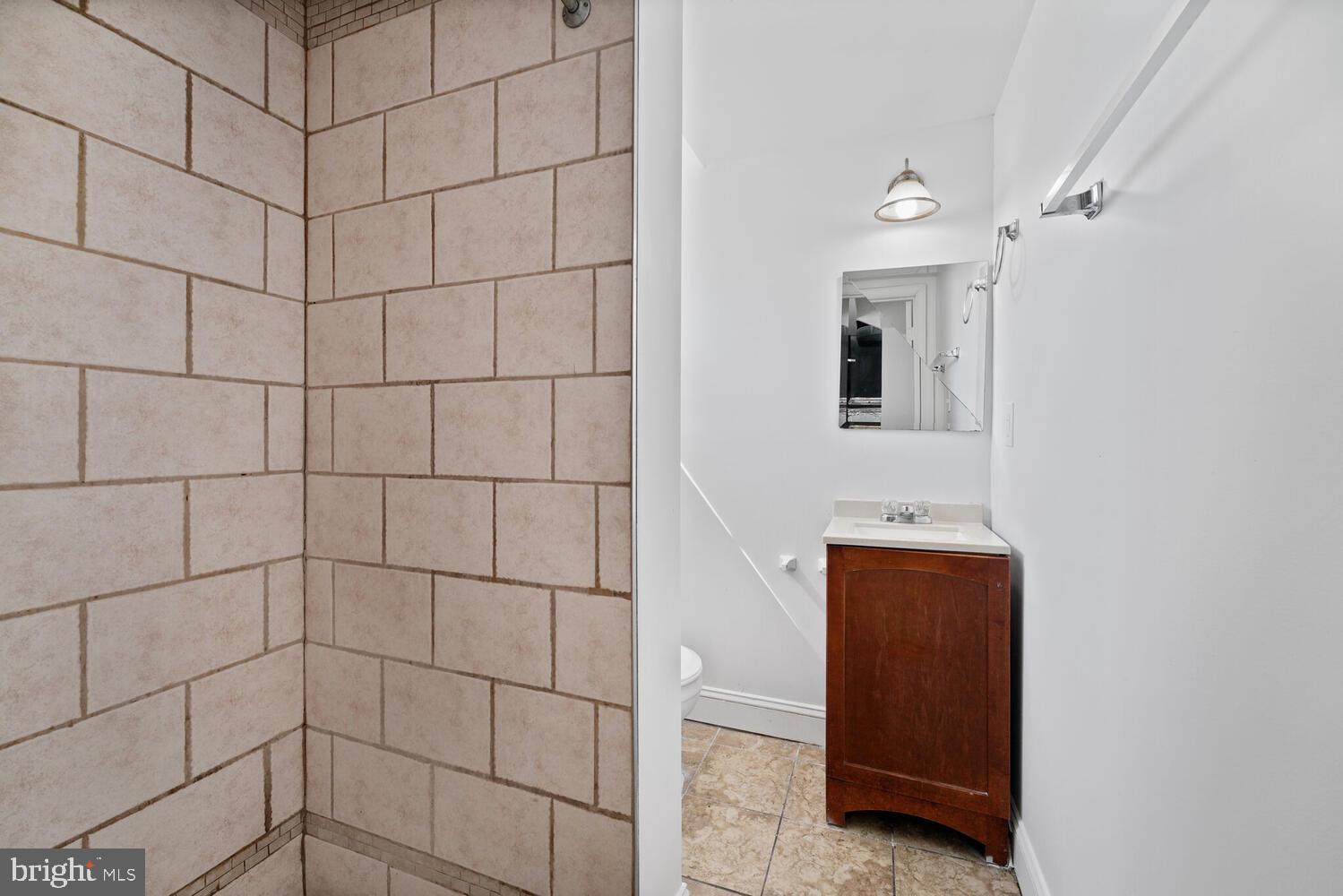 212 Division Avenue Northeast Washington, DC 20019 - Photo 12 of 21 a bathroom with a shower