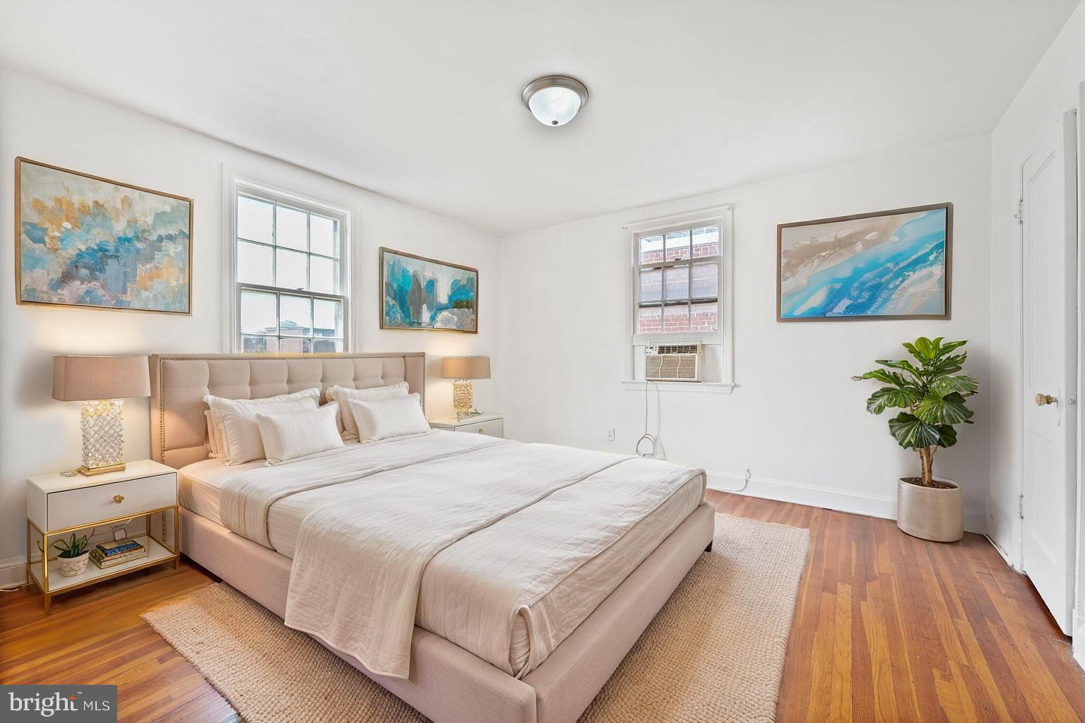 212 Division Avenue Northeast Washington, DC 20019 - Photo 10 of 21 a bedroom with a large bed and a painting on the wall