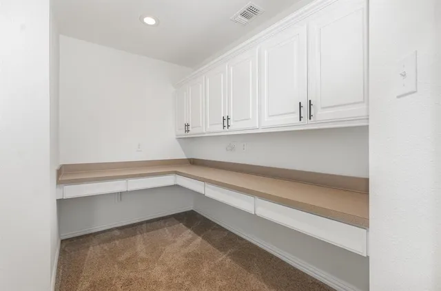 a view of cabinets and window