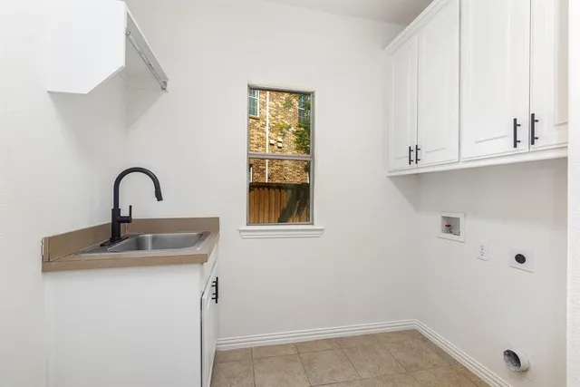 a bathroom with a sink and window
