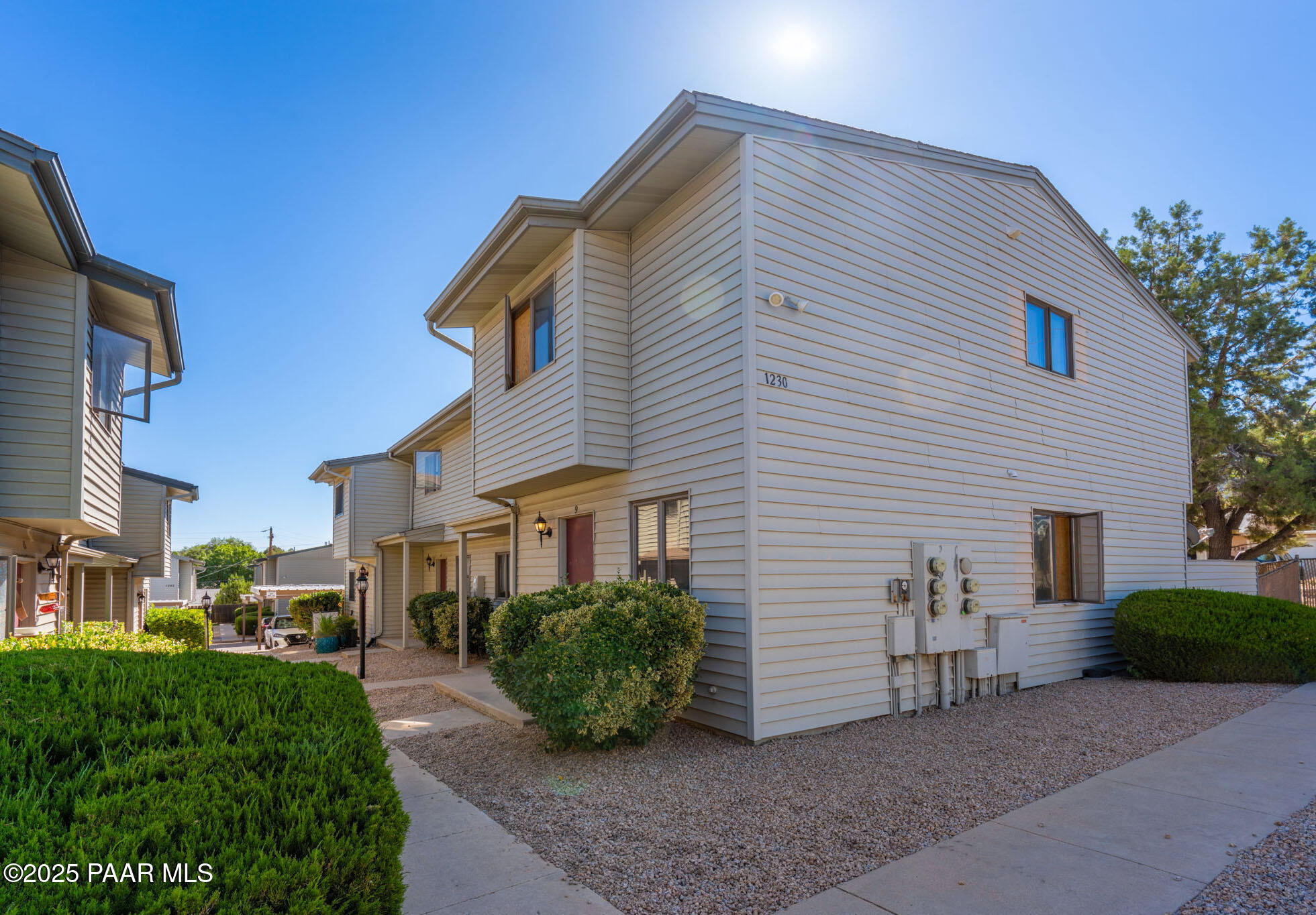 a view of a house with a yard and plants