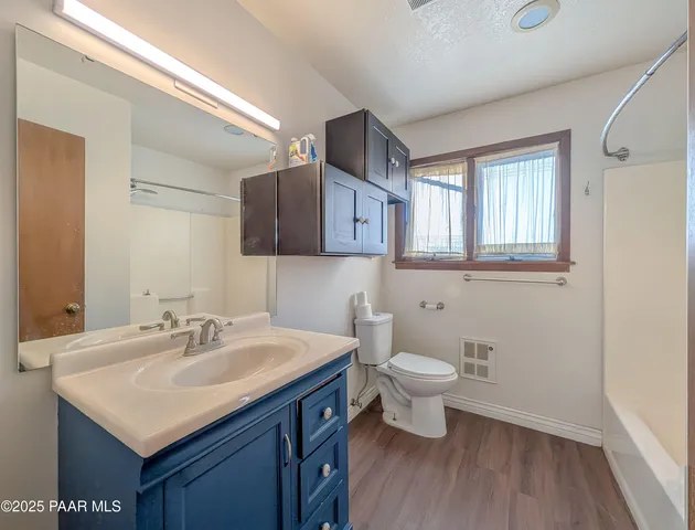 a view of a bedroom with washer and dryer