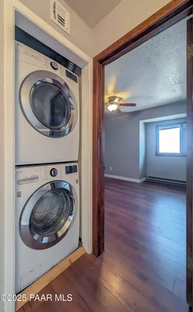 a view of a bedroom with washer and dryer