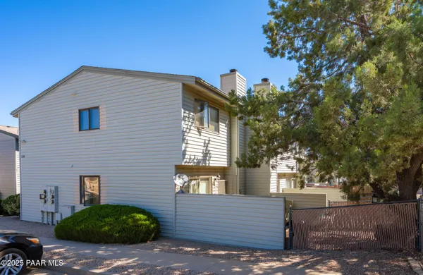 a view of a house with a tree