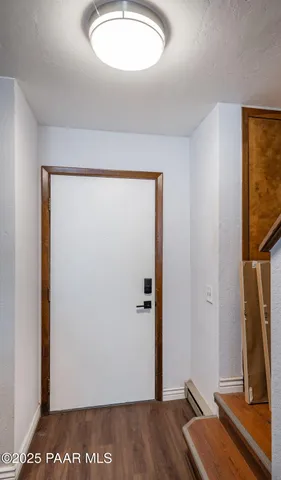 a view of a room with a flat screen tv