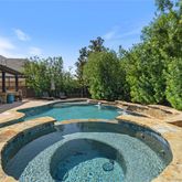 a view of swimming pool with a yard