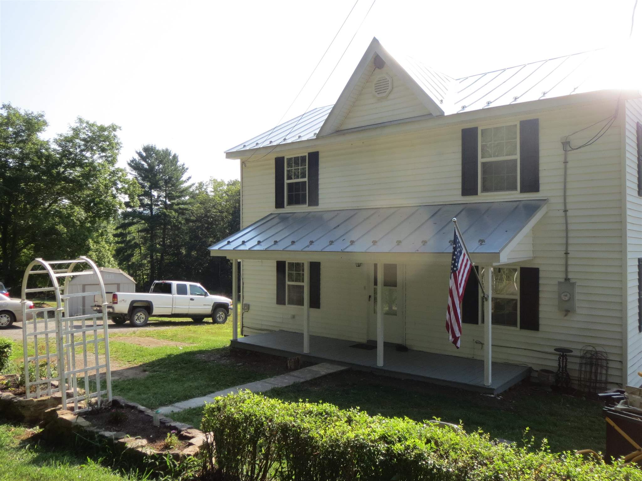 2600 Middle Cove Run Road Mathias, WV 26812 - Photo 11 of 38 a front view of a house with a garden