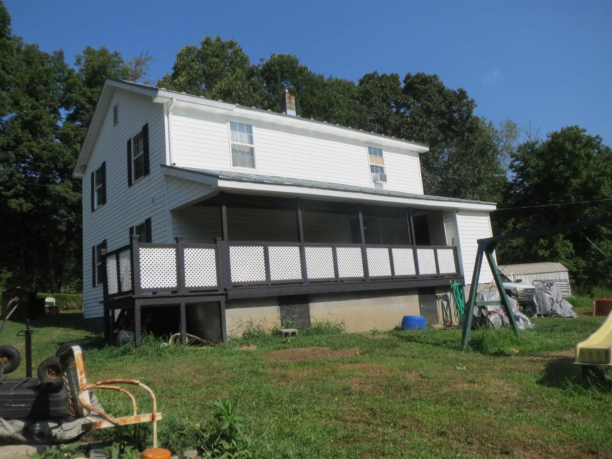 2600 Middle Cove Run Road Mathias, WV 26812 - Photo 4 of 38 a view of a house with backyard sitting area and garden