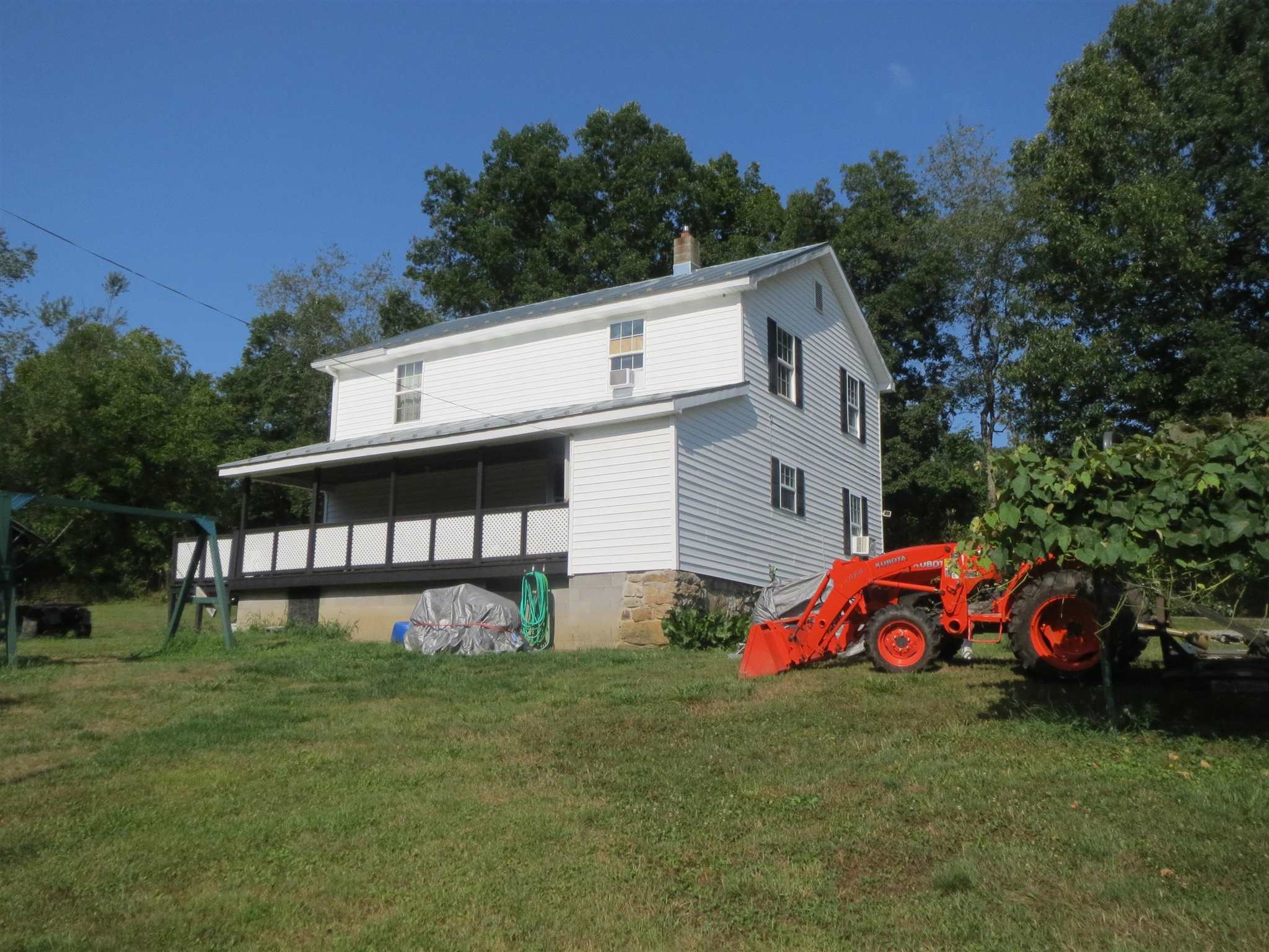 2600 Middle Cove Run Road Mathias, WV 26812 - Photo 5 of 38 a front view of a house with garden
