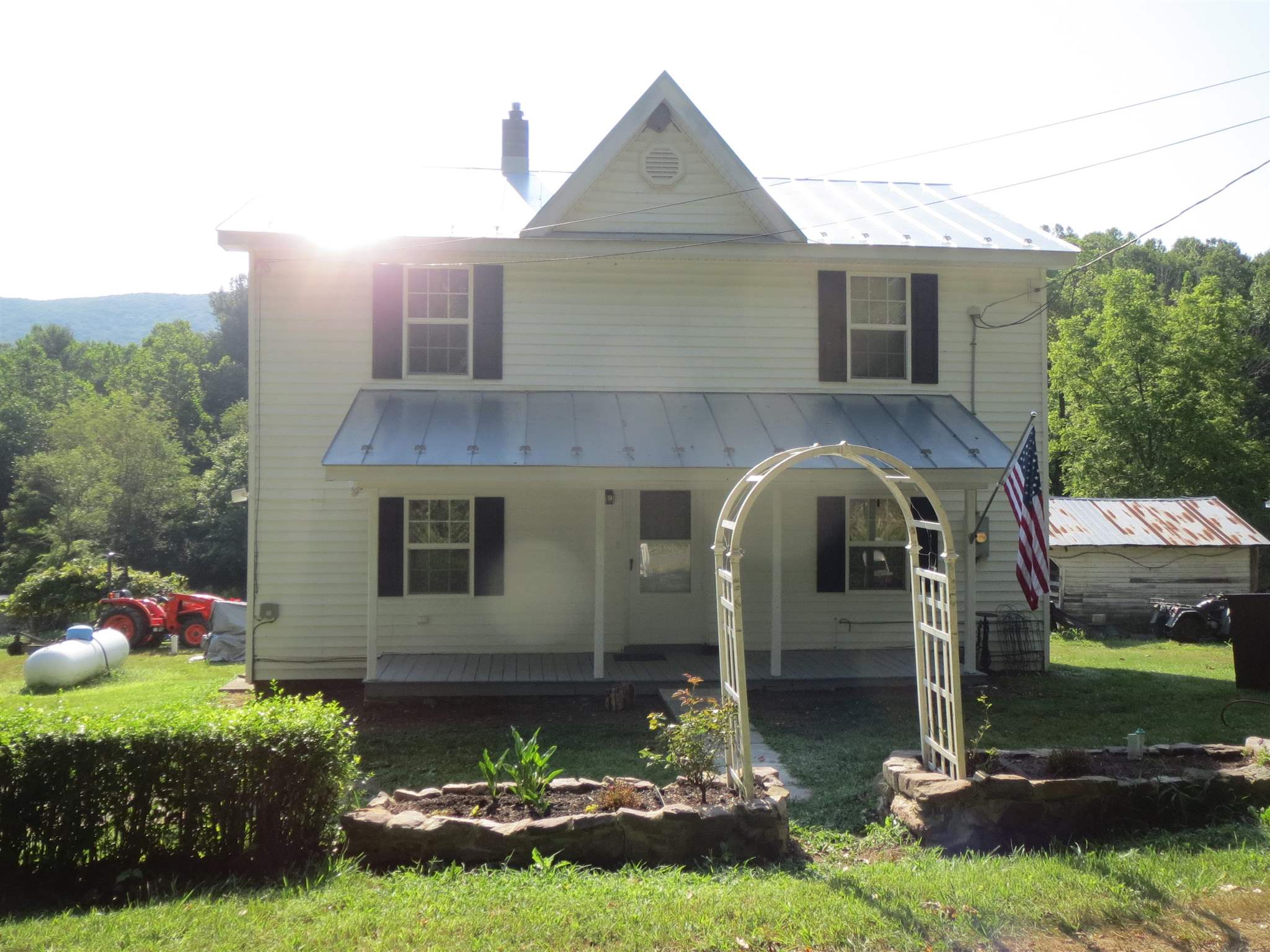 2600 Middle Cove Run Road Mathias, WV 26812 - Photo 10 of 38 a front view of a house with garden