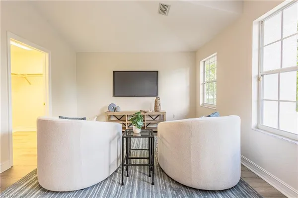 a view of a dining room with furniture and wooden floor