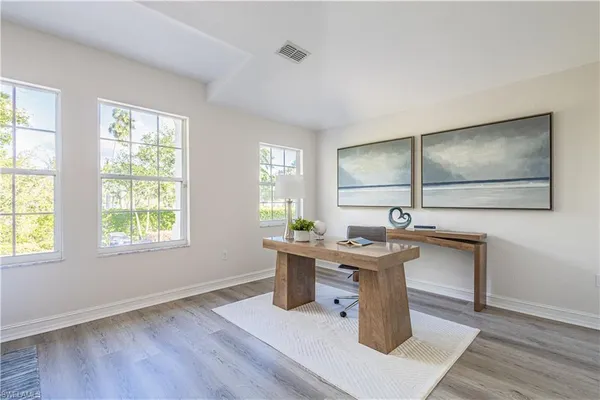 a view of livingroom with furniture and wooden floor