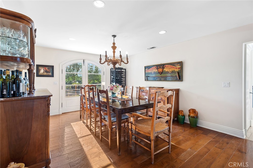 5747 Hoback Glen Road Hidden Hills, CA 91302 - Photo 14 of 37 a view of a dining room with furniture and wooden floor