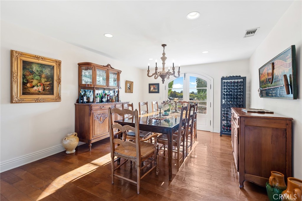 5747 Hoback Glen Road Hidden Hills, CA 91302 - Photo 15 of 37 a view of a dining room with furniture window and wooden floor