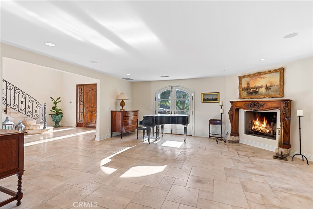 5747 Hoback Glen Road Hidden Hills, CA 91302 - Photo 2 of 37 a living room with furniture and a fireplace