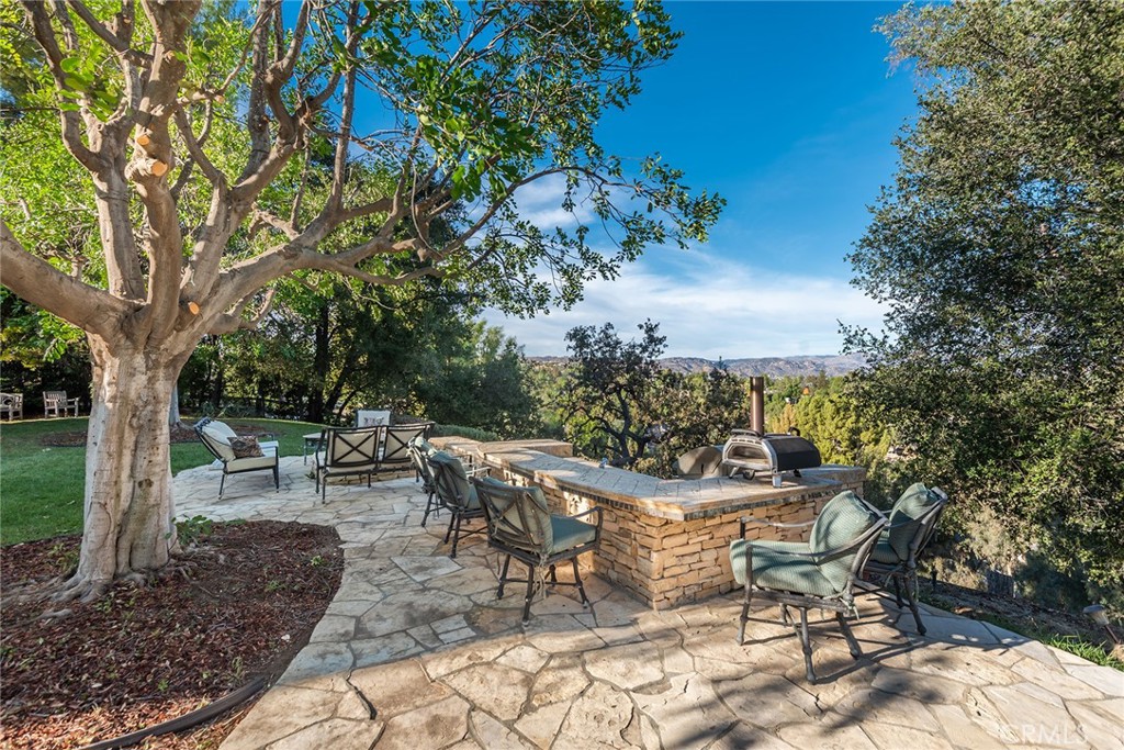 5747 Hoback Glen Road Hidden Hills, CA 91302 - Photo 28 of 37 a view of a backyard with sitting area