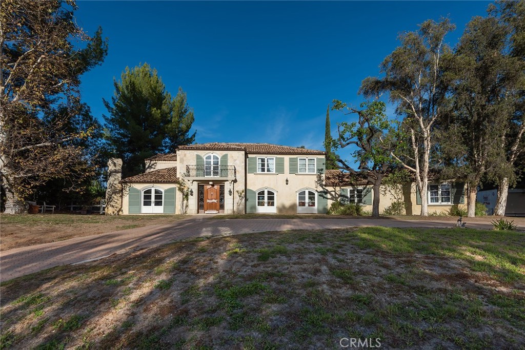 5747 Hoback Glen Road Hidden Hills, CA 91302 - Photo 37 of 37 a front view of a house with a garden