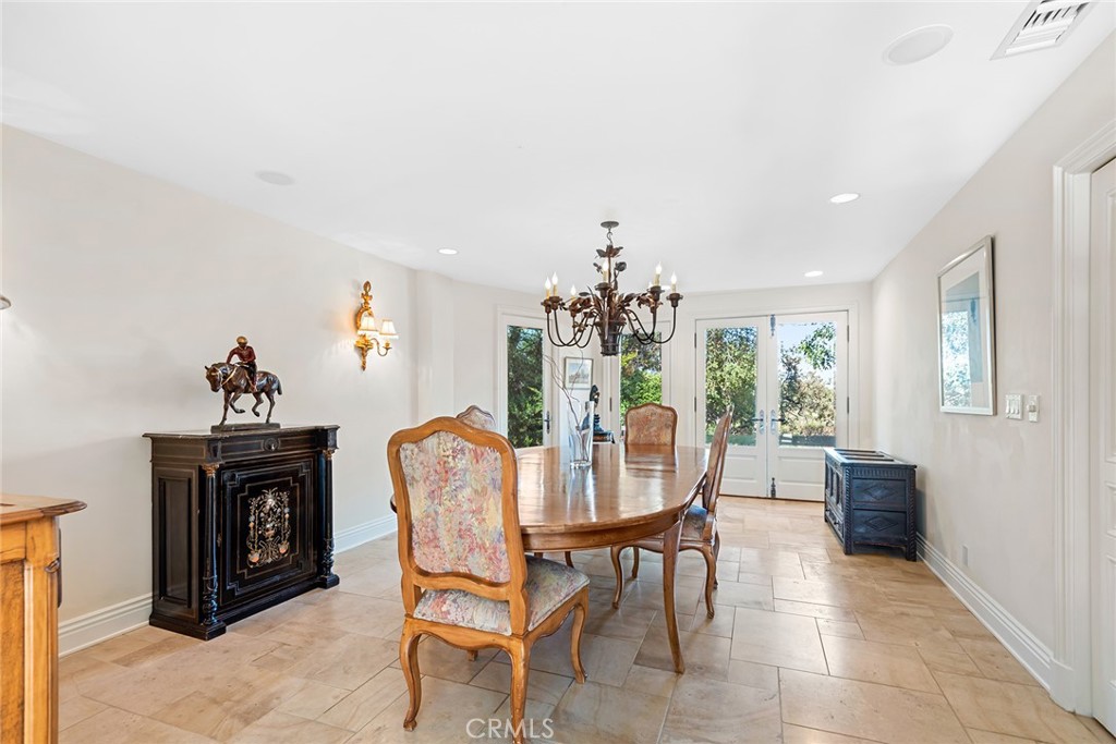5747 Hoback Glen Road Hidden Hills, CA 91302 - Photo 5 of 37 a dining room with furniture and window