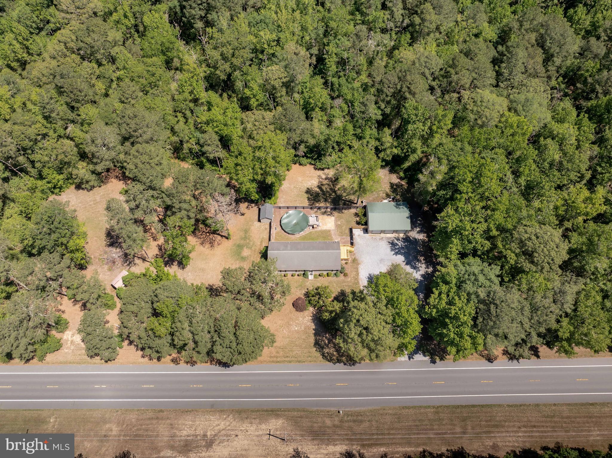 6635 Libertytown Road Berlin, MD 21811 - Photo 84 of 88 an aerial view of a house with a yard and large trees