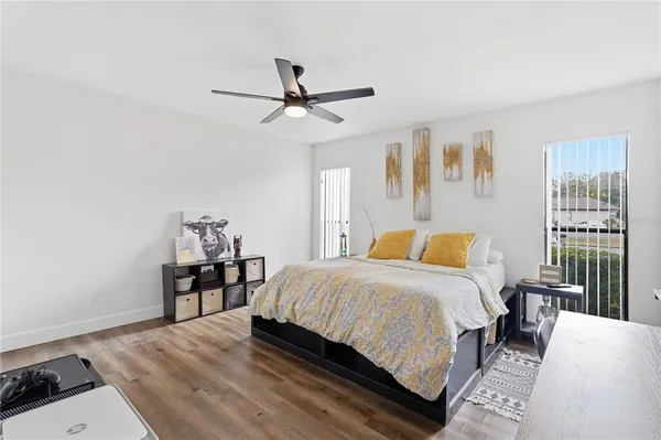 a bedroom with a bed and a table in it