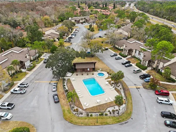 an aerial view of a house with a swimming pool