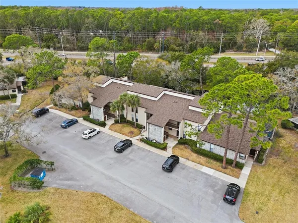 an aerial view of a swimming pool a yard and lake view