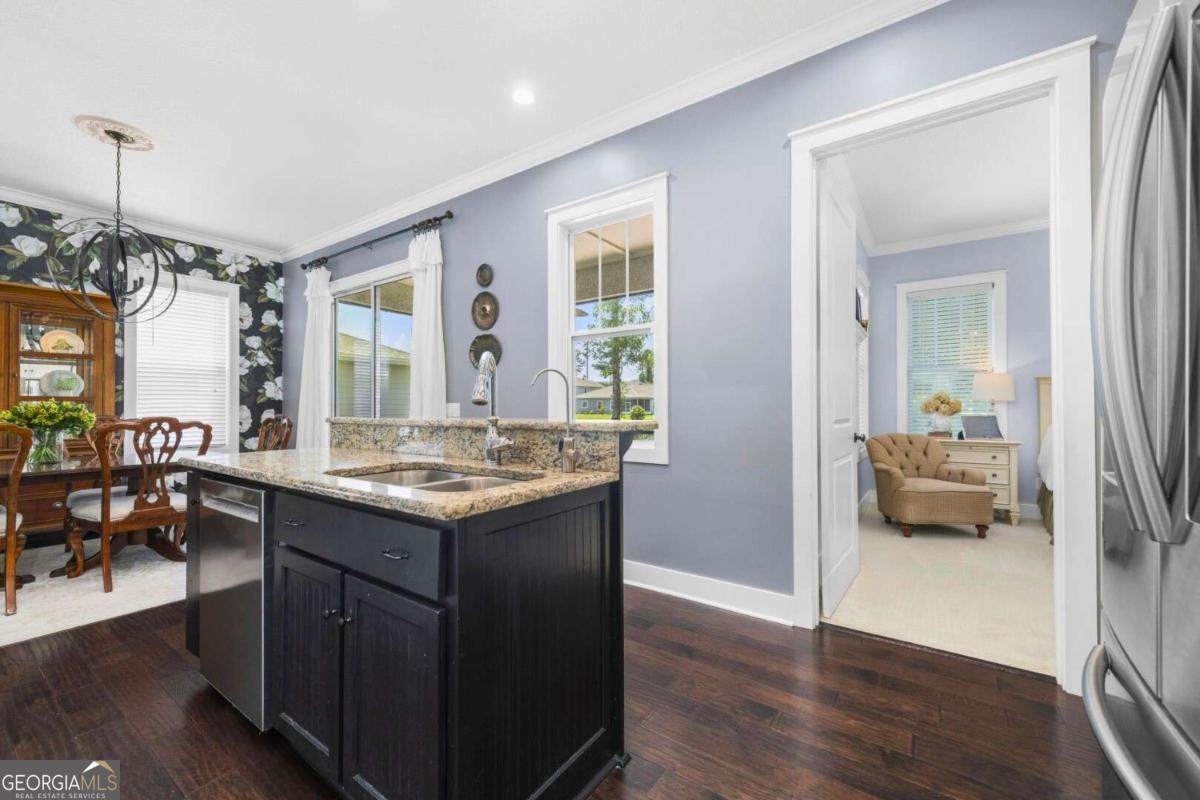 106 Boatsman Way St. Marys, GA 31558 - Photo 13 of 52 a kitchen with a stove and a wooden floor