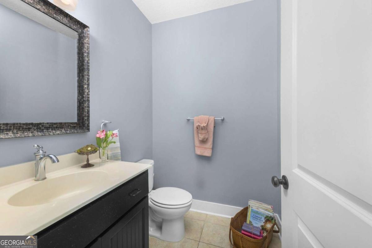 106 Boatsman Way St. Marys, GA 31558 - Photo 19 of 52 a bathroom with a sink mirror vanity and toilet