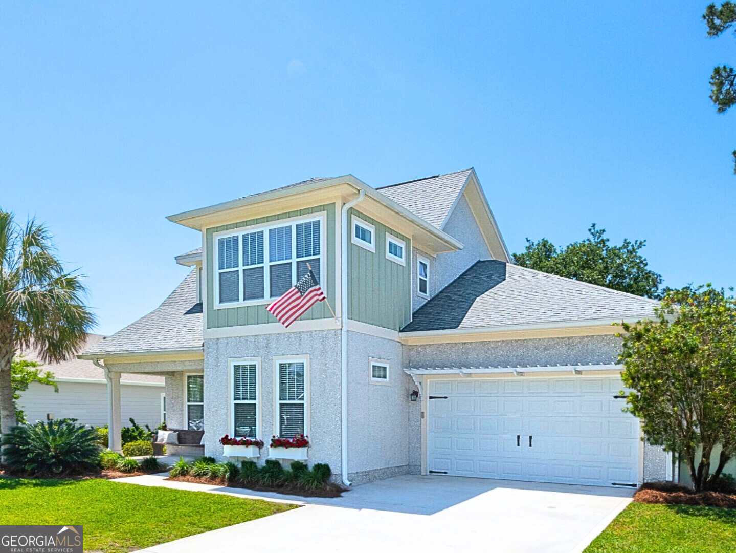 106 Boatsman Way St. Marys, GA 31558 - Photo 2 of 52 a view of a white house with a big yard and potted plants