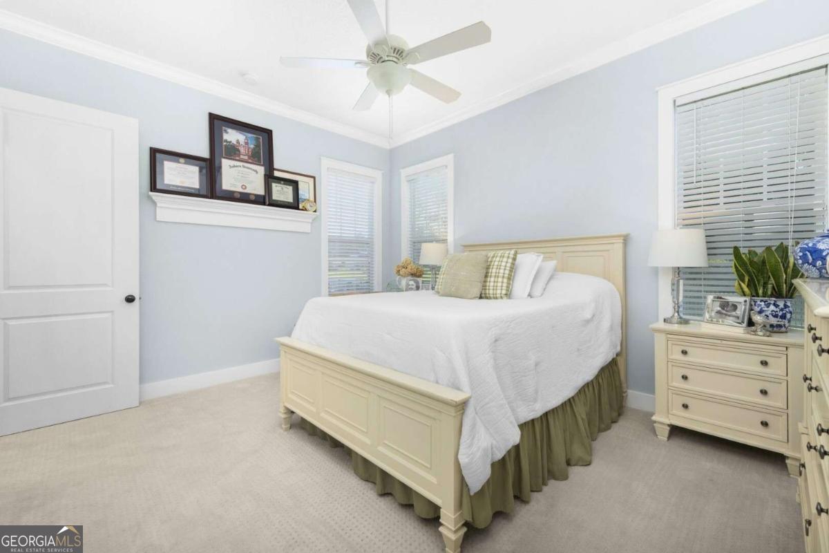 106 Boatsman Way St. Marys, GA 31558 - Photo 22 of 52 a bedroom with a bed and a dresser