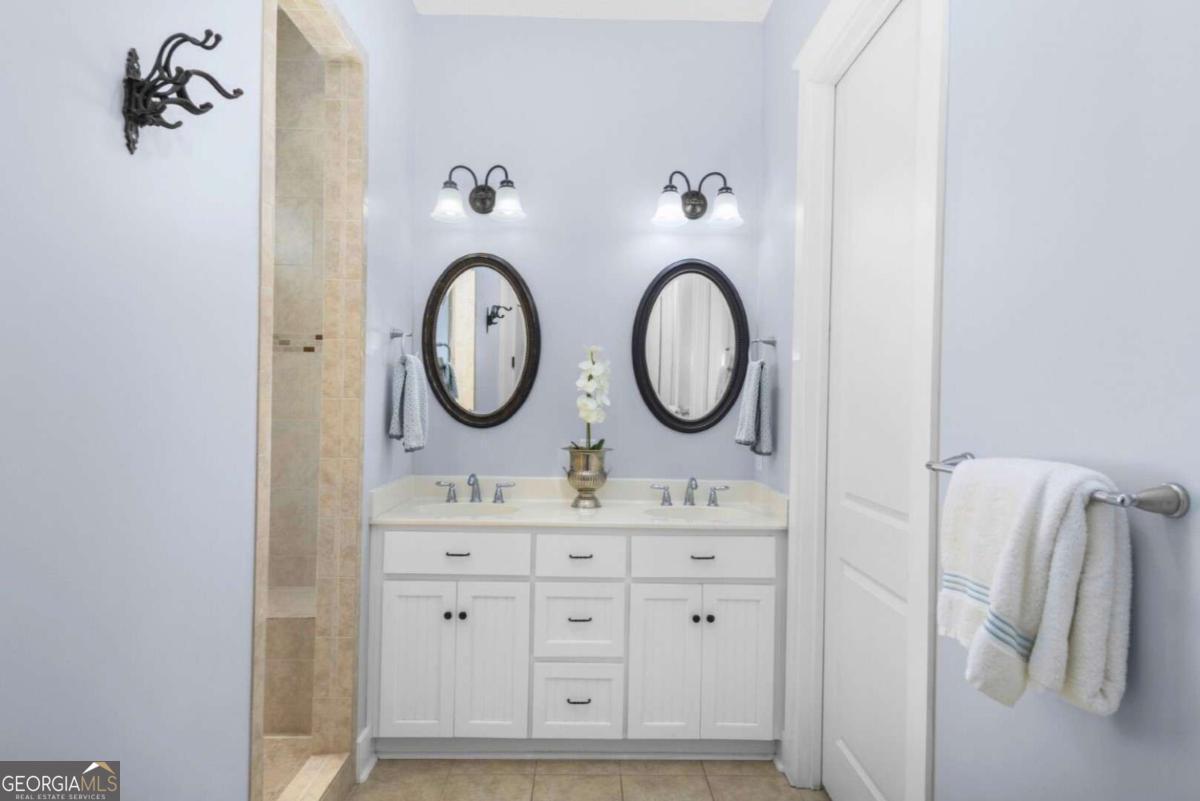 106 Boatsman Way St. Marys, GA 31558 - Photo 24 of 52 a bathroom with a sink and a mirror