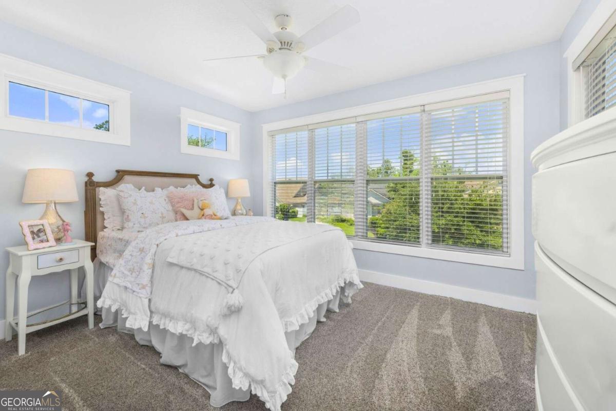106 Boatsman Way St. Marys, GA 31558 - Photo 29 of 52 a bedroom with a large bed and a window