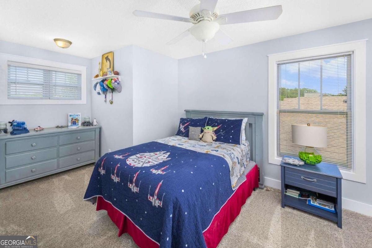 106 Boatsman Way St. Marys, GA 31558 - Photo 31 of 52 a bedroom with a bed and a window