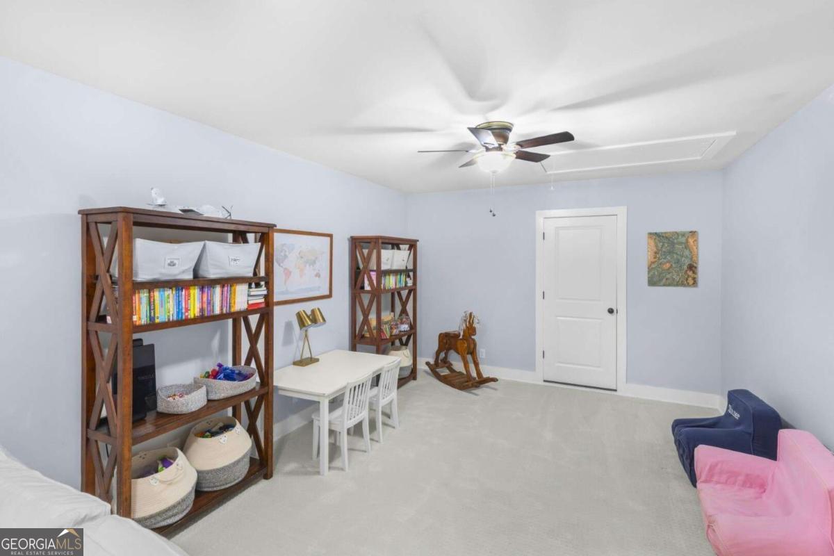 106 Boatsman Way St. Marys, GA 31558 - Photo 33 of 52 a view of a livingroom with furniture and a ceiling fan