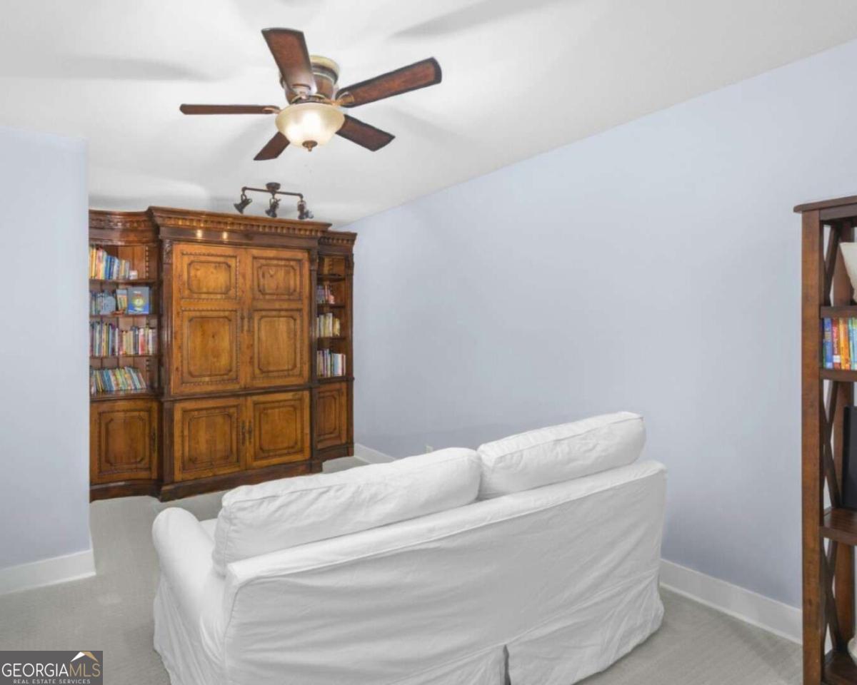 106 Boatsman Way St. Marys, GA 31558 - Photo 34 of 52 a bedroom with a bed and cabinets