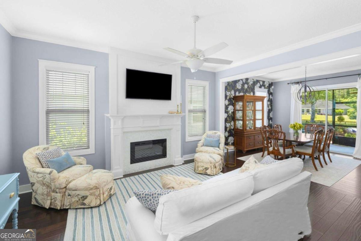 106 Boatsman Way St. Marys, GA 31558 - Photo 4 of 52 a living room with furniture a fireplace and a flat screen tv