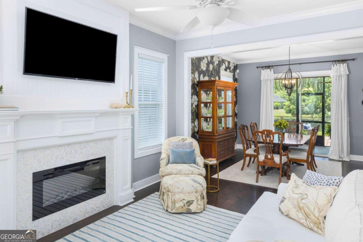 106 Boatsman Way St. Marys, GA 31558 - Photo 5 of 52 a living room with furniture a flat screen tv and a fireplace