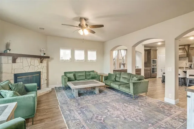 a living room with furniture and a fireplace