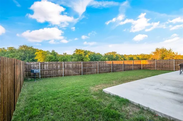 a view of a backyard with a garden