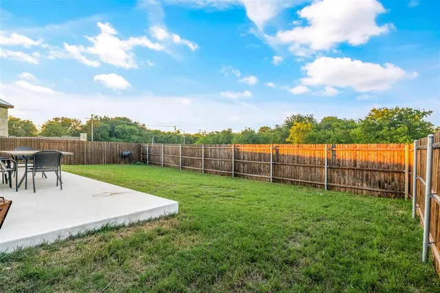 a view of a backyard with a garden