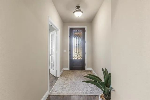 an entryway with a flower pot