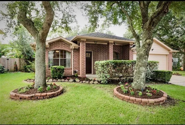 a front view of a house with a yard and porch
