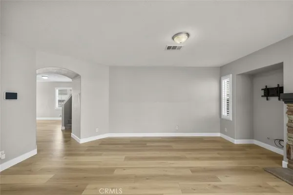 a view of a livingroom with wooden floor