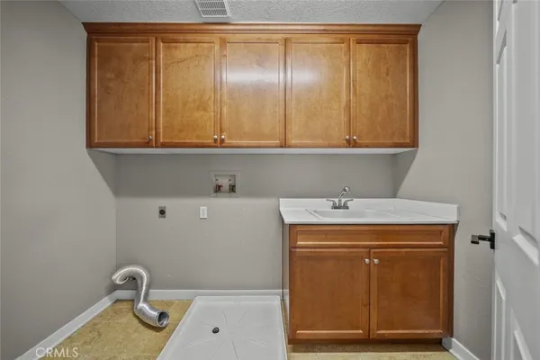 a bathroom with a sink and vanity