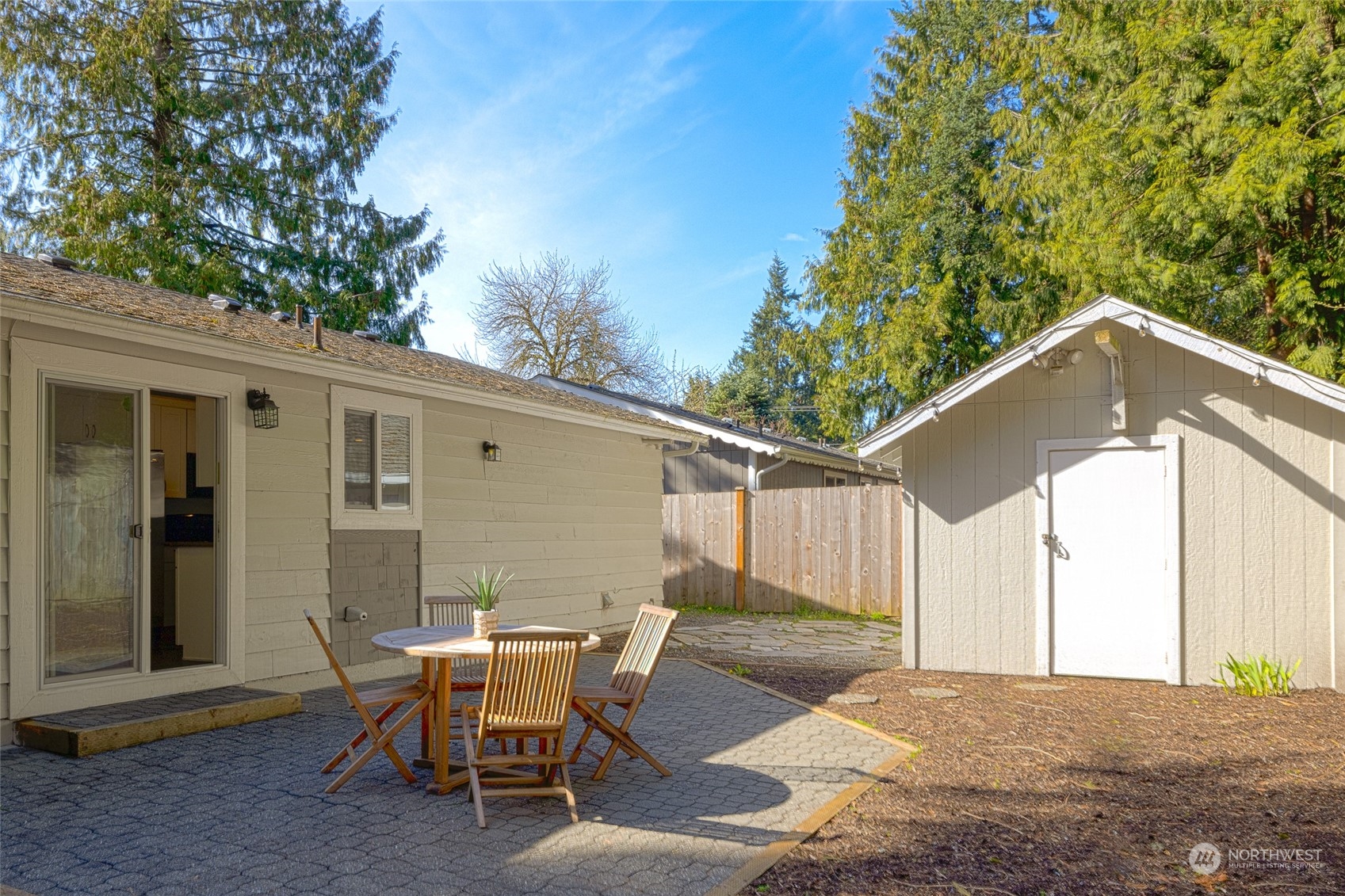 13411 Meridian Drive Southeast Everett, WA 98208 - Photo 16 of 20 a backyard of a house with a table and chairs