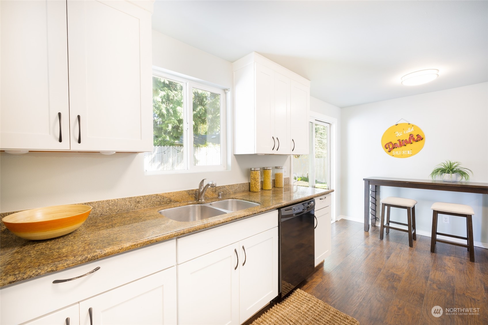13411 Meridian Drive Southeast Everett, WA 98208 - Photo 8 of 20 a kitchen with a sink window and cabinets