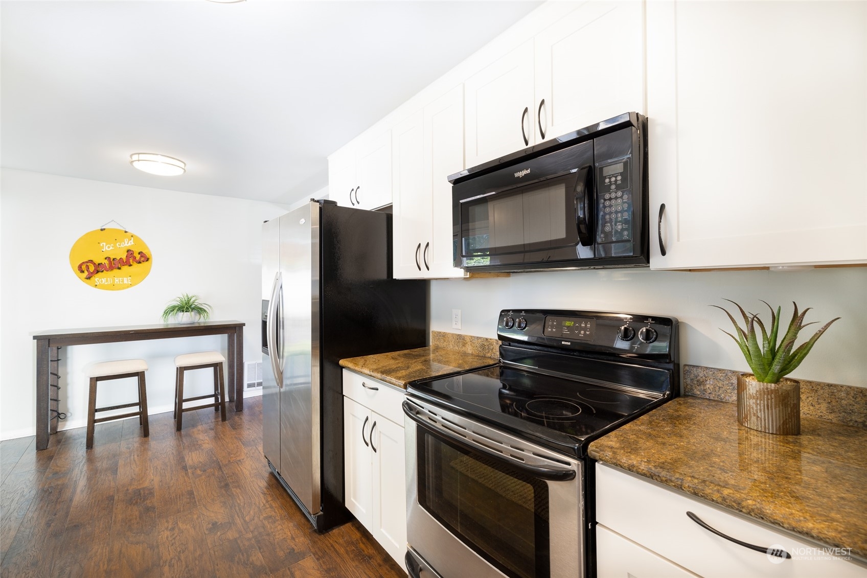 13411 Meridian Drive Southeast Everett, WA 98208 - Photo 9 of 20 a kitchen with a stove cabinets and microwave