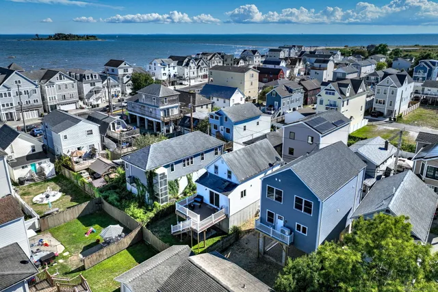 an aerial view of a house with outdoor space