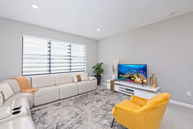 a living room with furniture and a couch