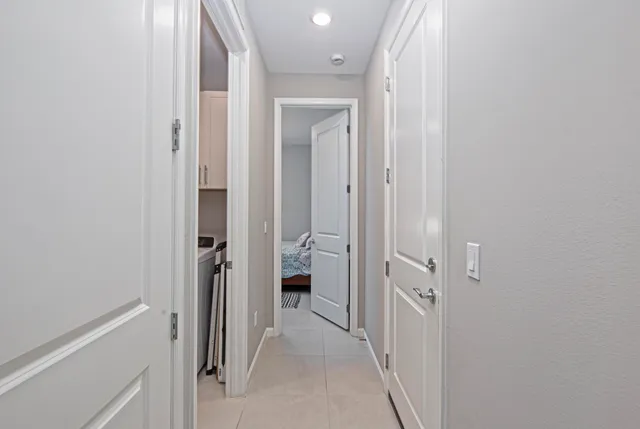 a view of a bathroom from a hallway